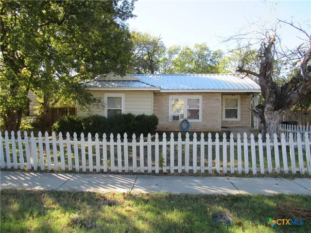 a front view of a house having yard