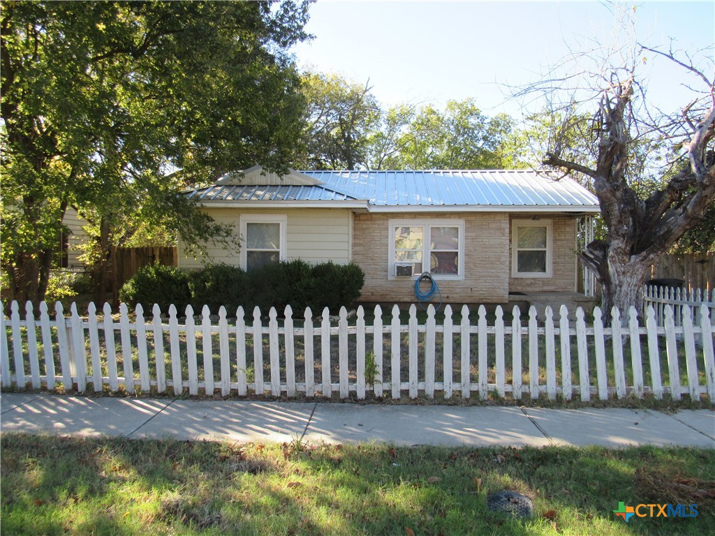 a front view of a house having yard