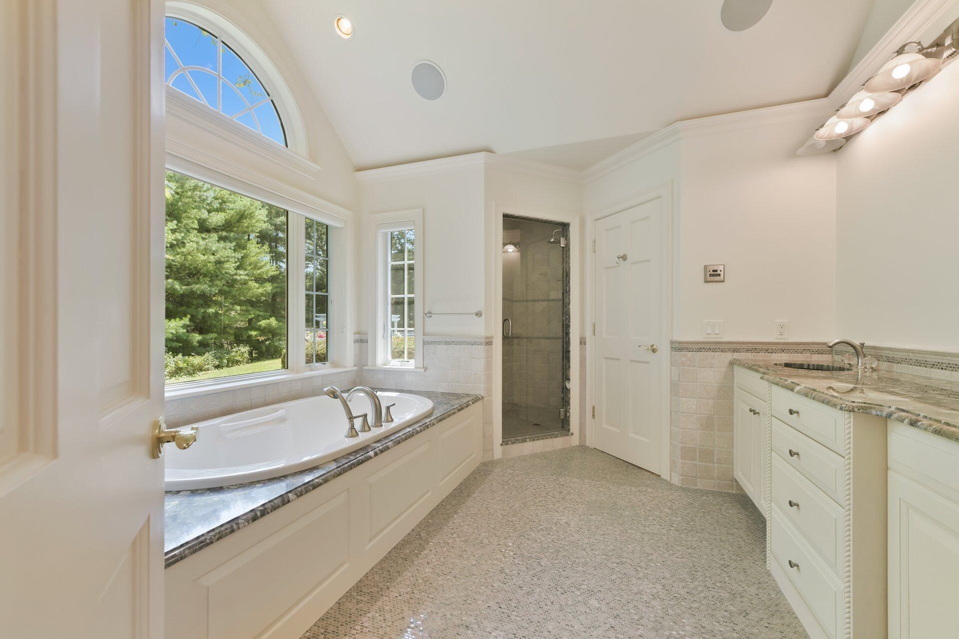 431 Baxter Neck Road Marstons Mills, MA 02648 - Photo 13 of 30 a spacious bathroom with a tub sink and mirror