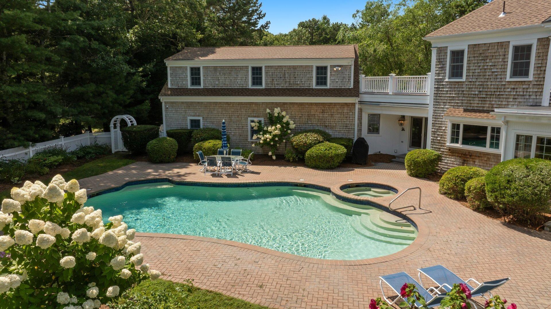431 Baxter Neck Road Marstons Mills, MA 02648 - Photo 19 of 30 a view of a backyard with plants and a patio