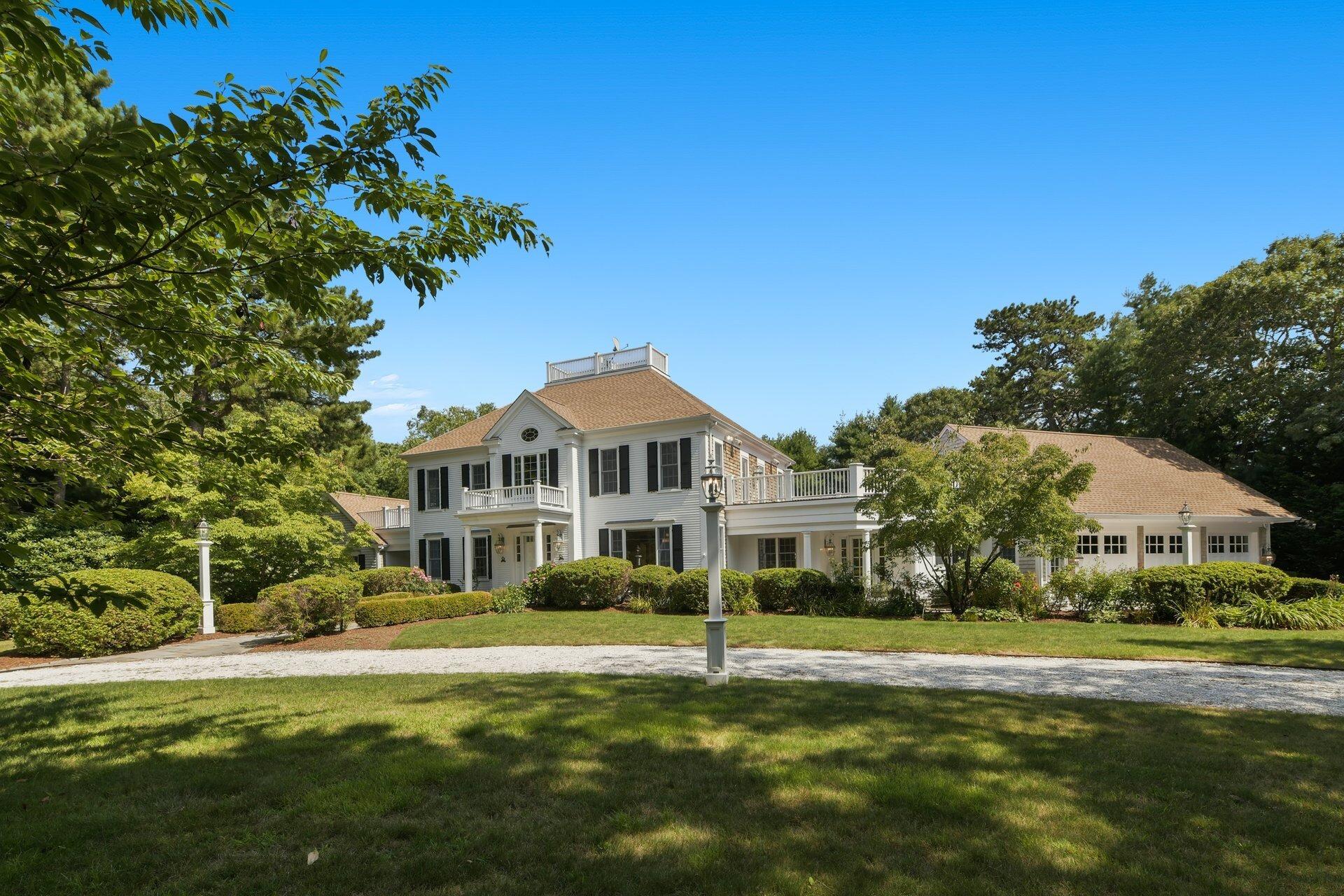 431 Baxter Neck Road Marstons Mills, MA 02648 - Photo 24 of 30 a front view of a house with a garden