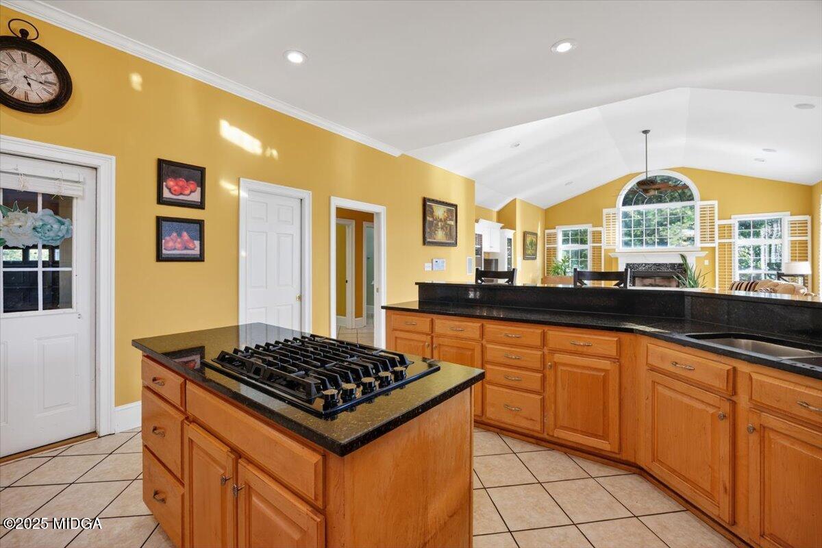176 Tumbling Shoals Drive Gray, GA 31032 - Photo 14 of 52 a kitchen with stainless steel appliances a stove a sink and a refrigerator