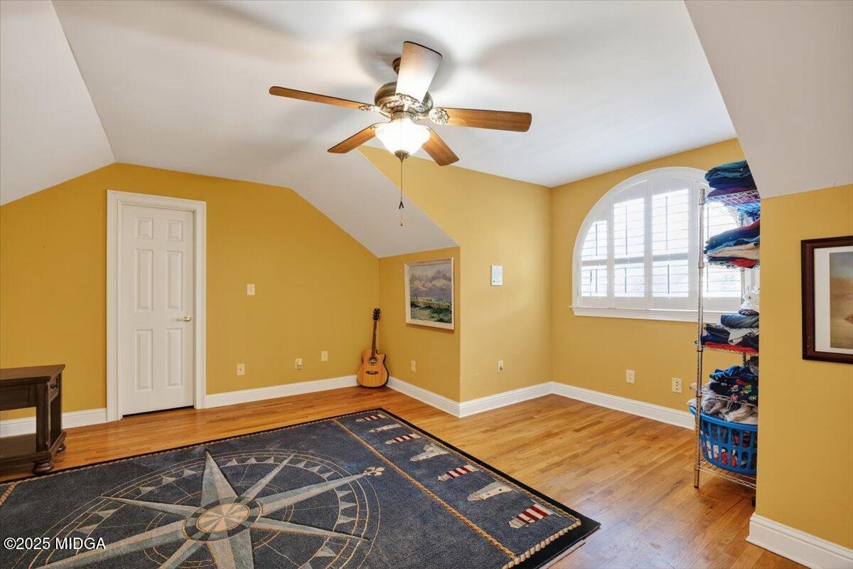 176 Tumbling Shoals Drive Gray, GA 31032 - Photo 26 of 52 a view of an empty room with window and wooden floor