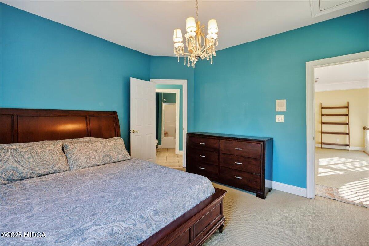 176 Tumbling Shoals Drive Gray, GA 31032 - Photo 33 of 52 a bedroom with a bed and a dresser