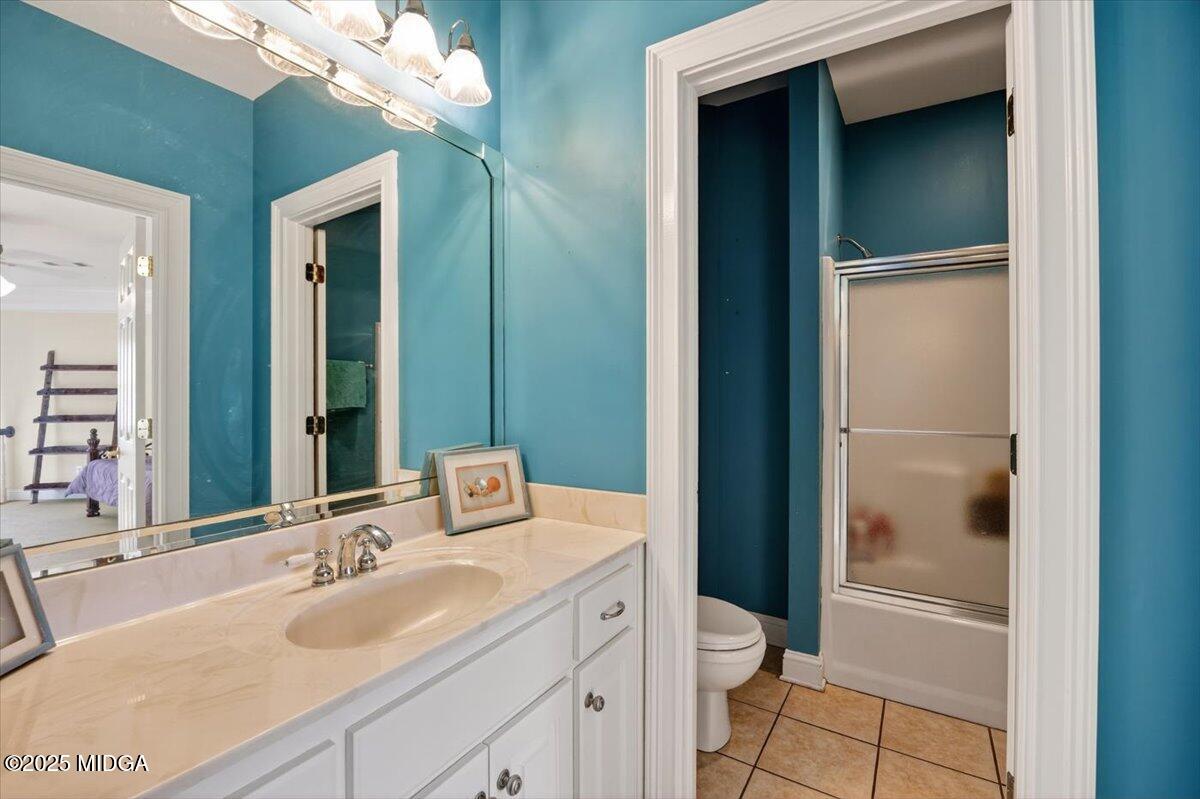 176 Tumbling Shoals Drive Gray, GA 31032 - Photo 34 of 52 a bathroom with a granite countertop sink toilet and shower