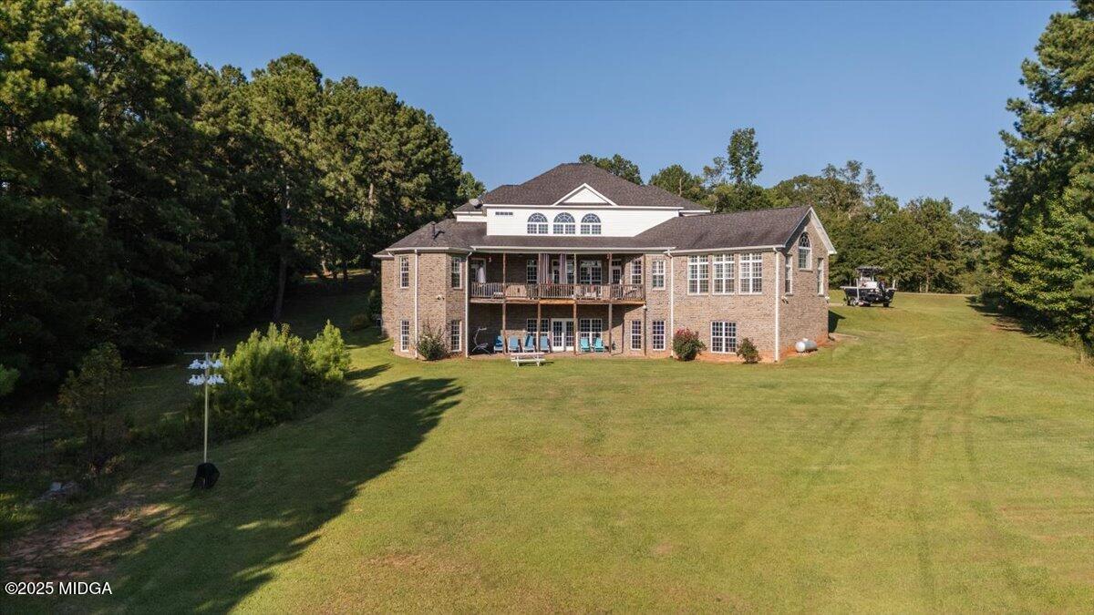 176 Tumbling Shoals Drive Gray, GA 31032 - Photo 41 of 52 a view of a house with a yard and potted plants
