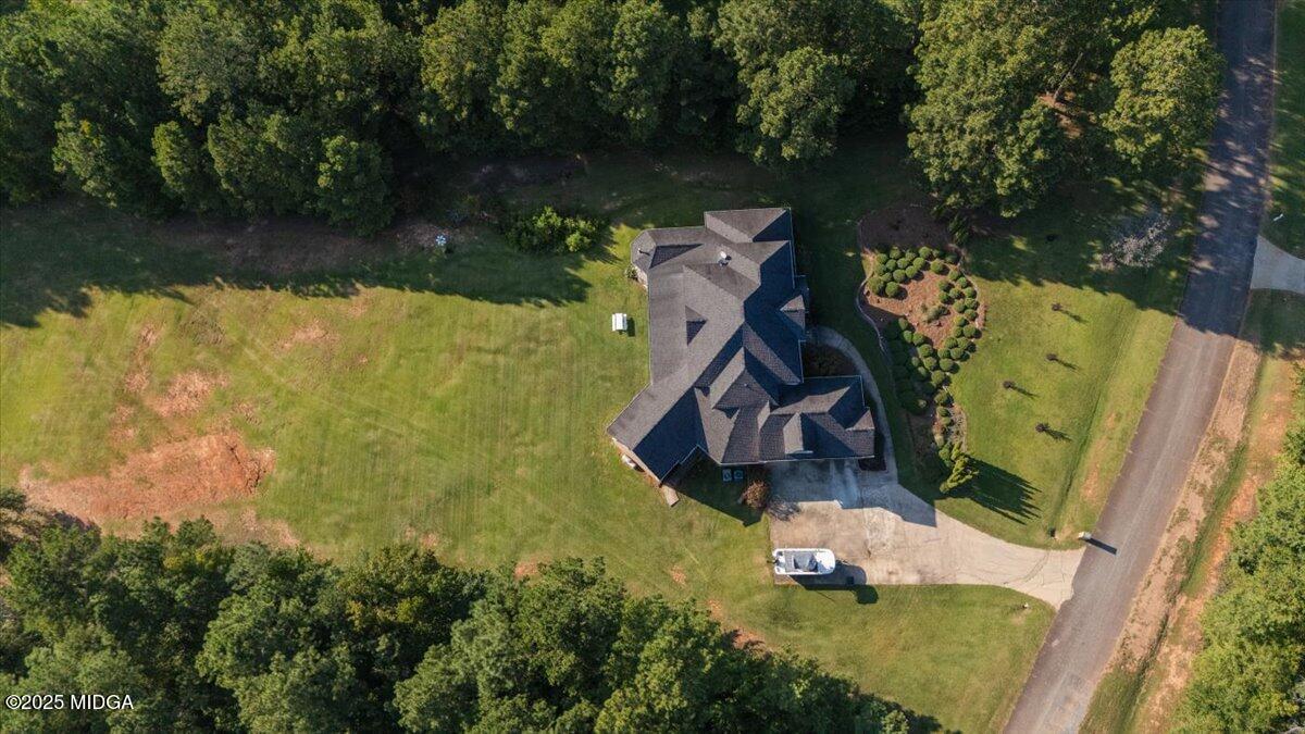 176 Tumbling Shoals Drive Gray, GA 31032 - Photo 50 of 52 an aerial view of a house with swimming pool and lake view