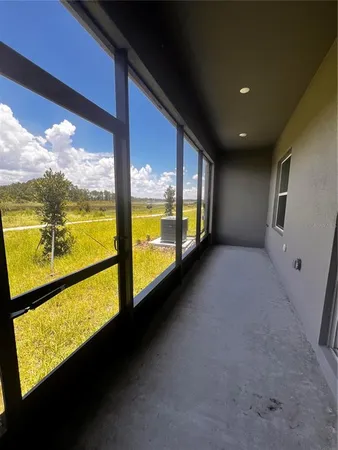 a view of an empty room and window