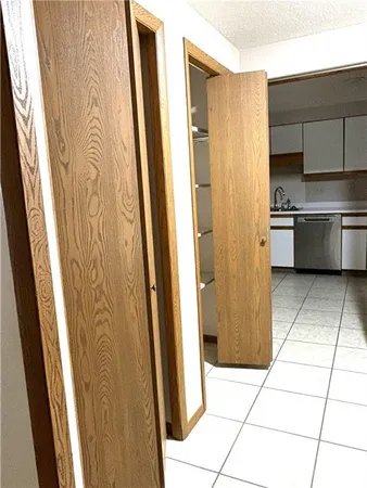 a view of hallway with wooden floor