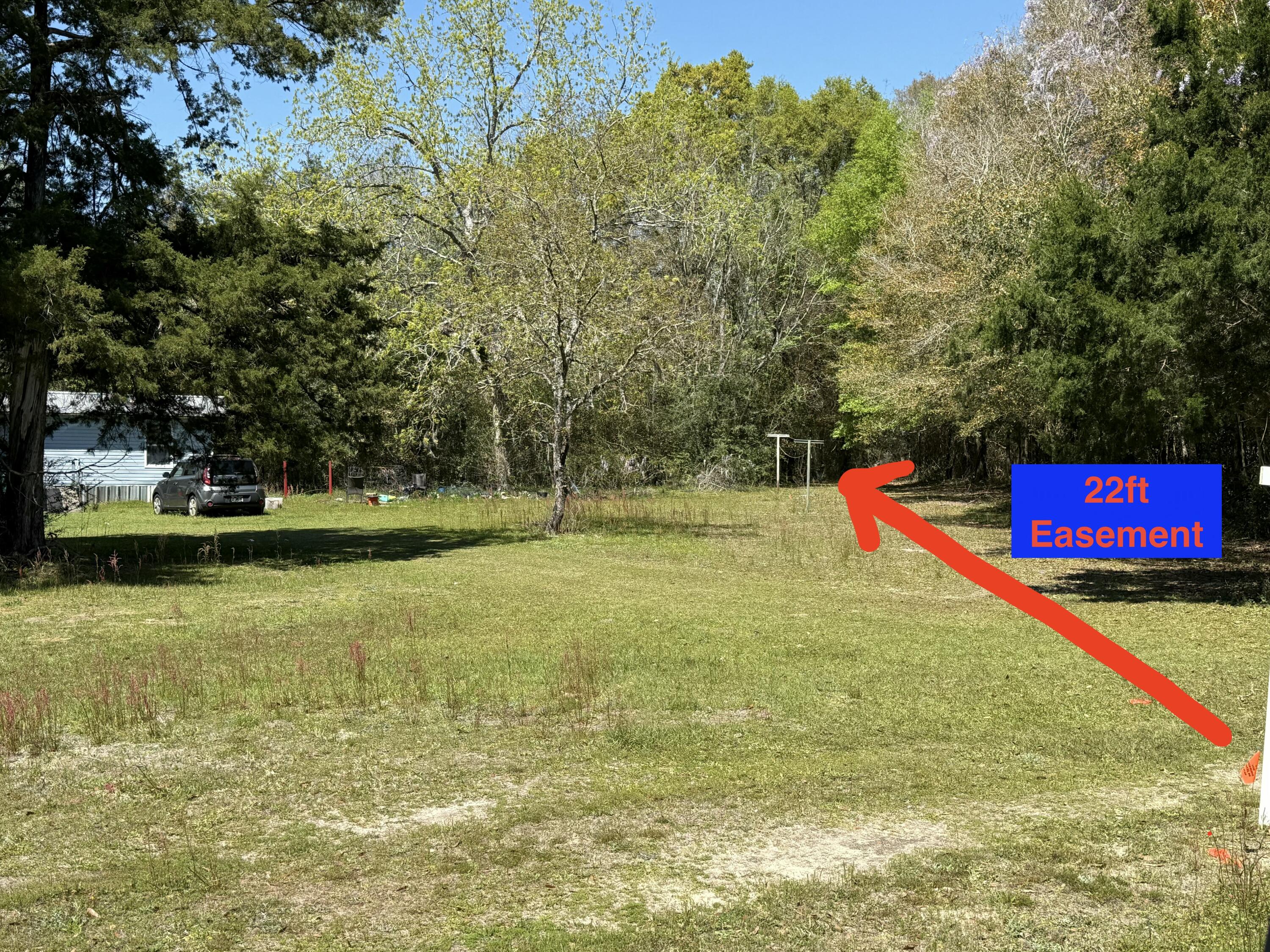 Tbd Strickland Road Ebro, FL 32437 - Photo 2 of 36 a view of yard with tree and deck