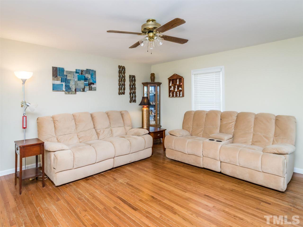 10017 Joe Leach Road Raleigh, NC 27603 - Photo 2 of 23 a living room with a couch