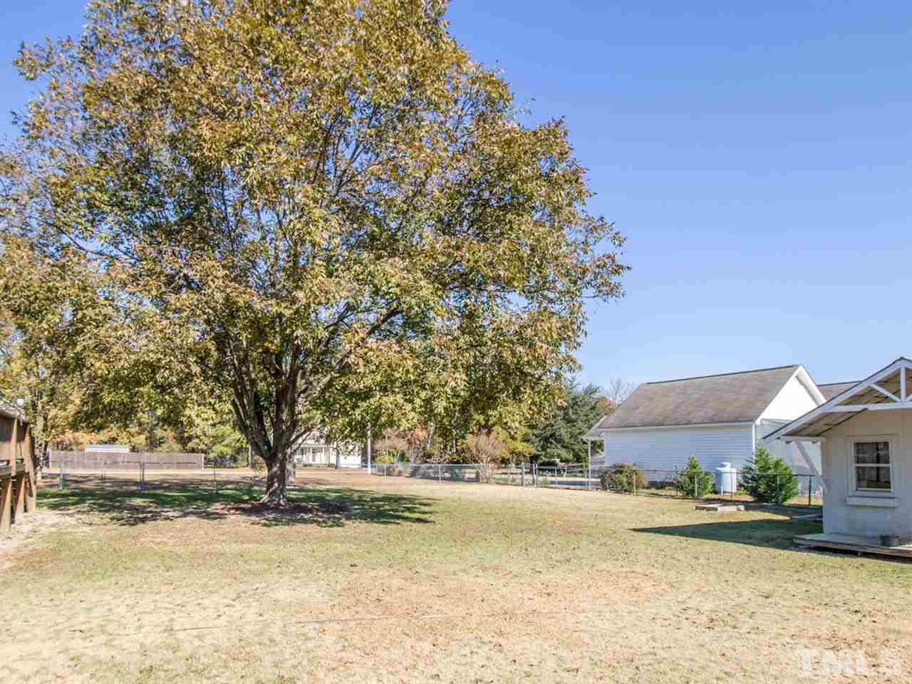 10017 Joe Leach Road Raleigh, NC 27603 - Photo 17 of 23 a view of a yard with a tree