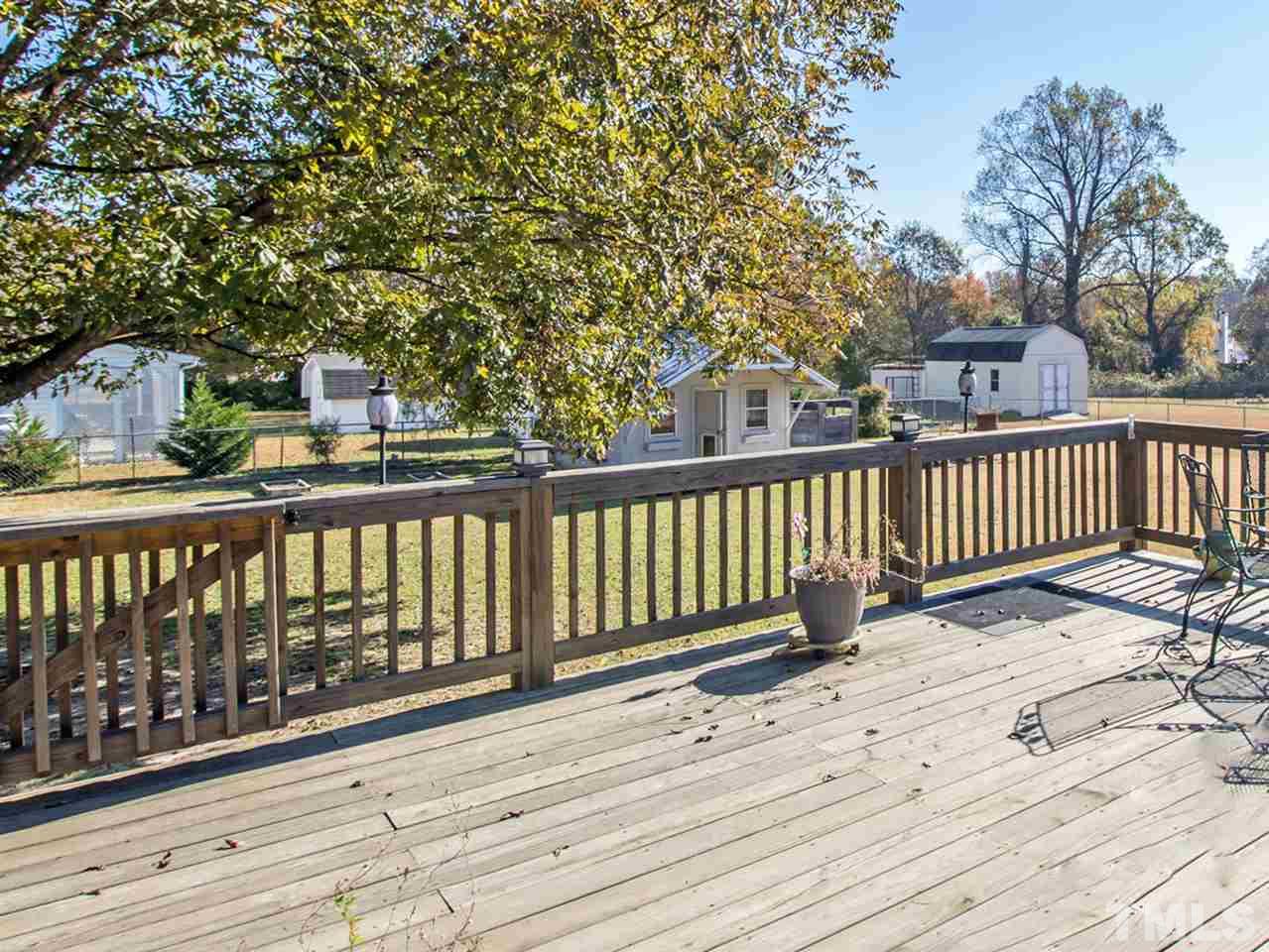10017 Joe Leach Road Raleigh, NC 27603 - Photo 20 of 23 a view of a wooden roof deck