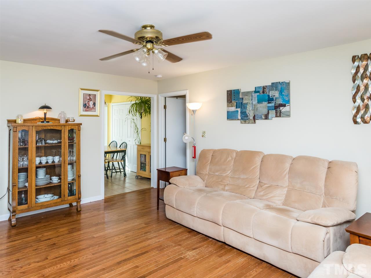 10017 Joe Leach Road Raleigh, NC 27603 - Photo 3 of 23 a living room with furniture and wooden floor