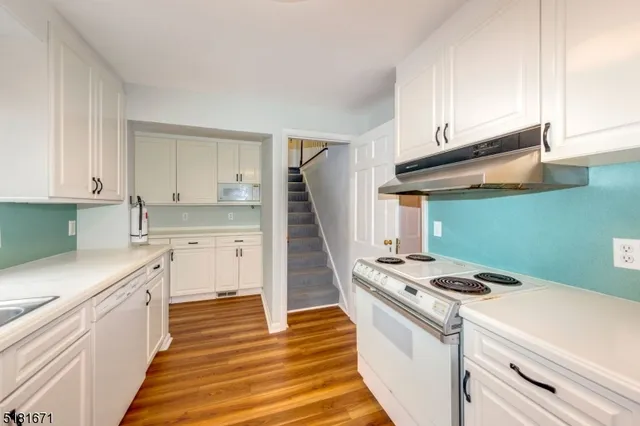 a kitchen with a stove and a sink