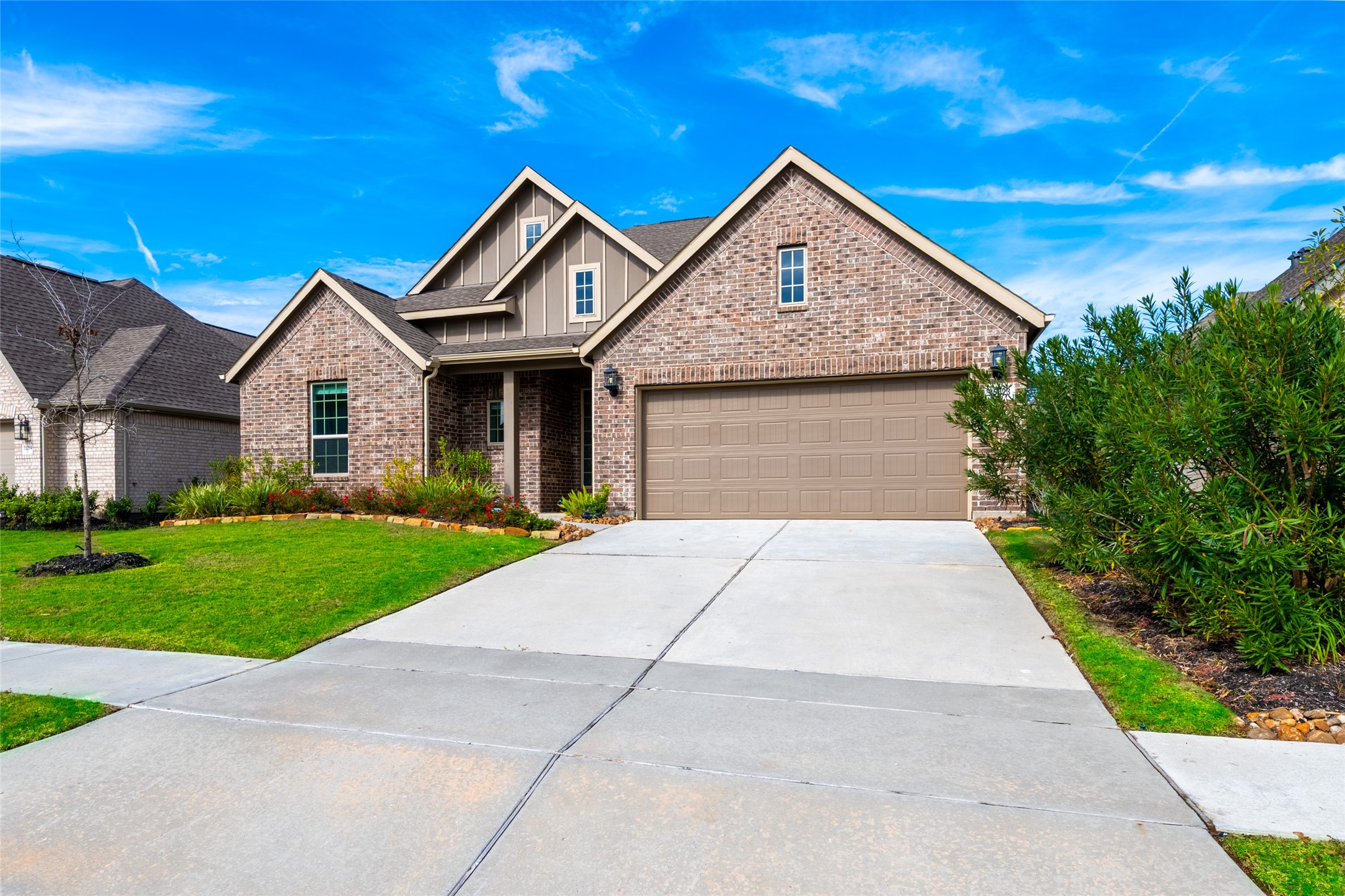15023 Mulberry Hallow Street Conroe, TX 77302 - Photo 2 of 41 a front view of a house with a yard and garage