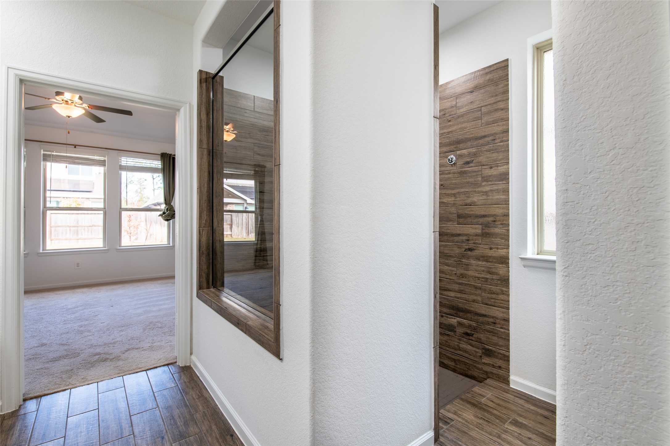 15023 Mulberry Hallow Street Conroe, TX 77302 - Photo 23 of 41 a view of hallway with stairs and wooden floor