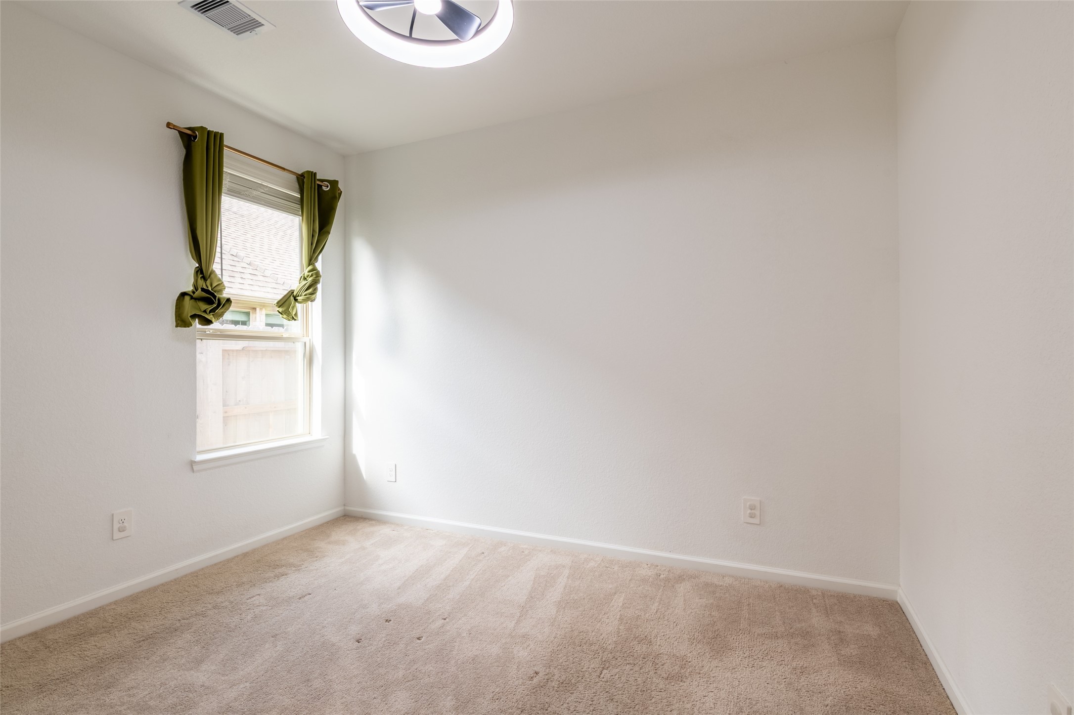 15023 Mulberry Hallow Street Conroe, TX 77302 - Photo 25 of 41 a view of an empty room and window