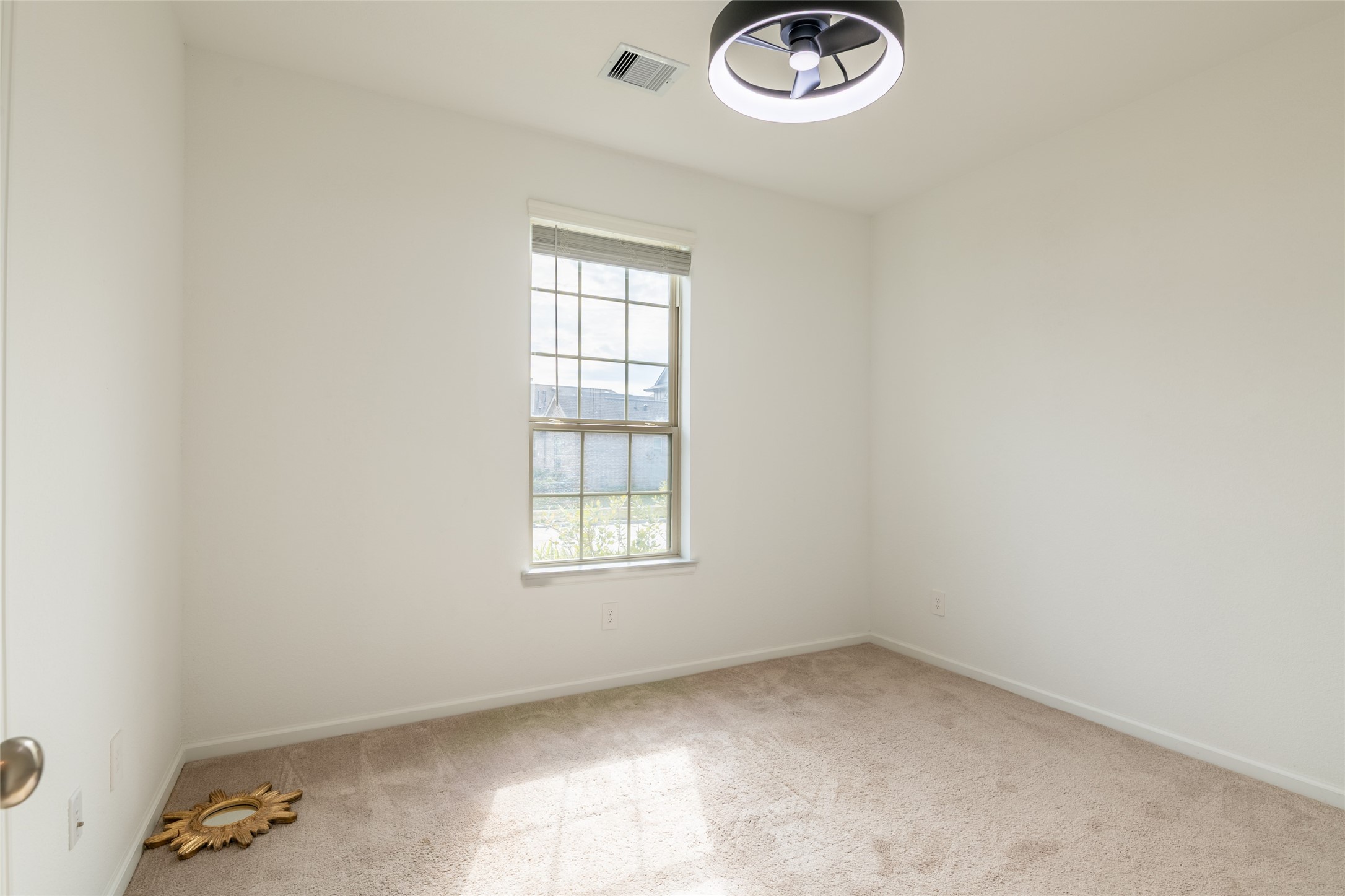 15023 Mulberry Hallow Street Conroe, TX 77302 - Photo 27 of 41 an empty room with windows