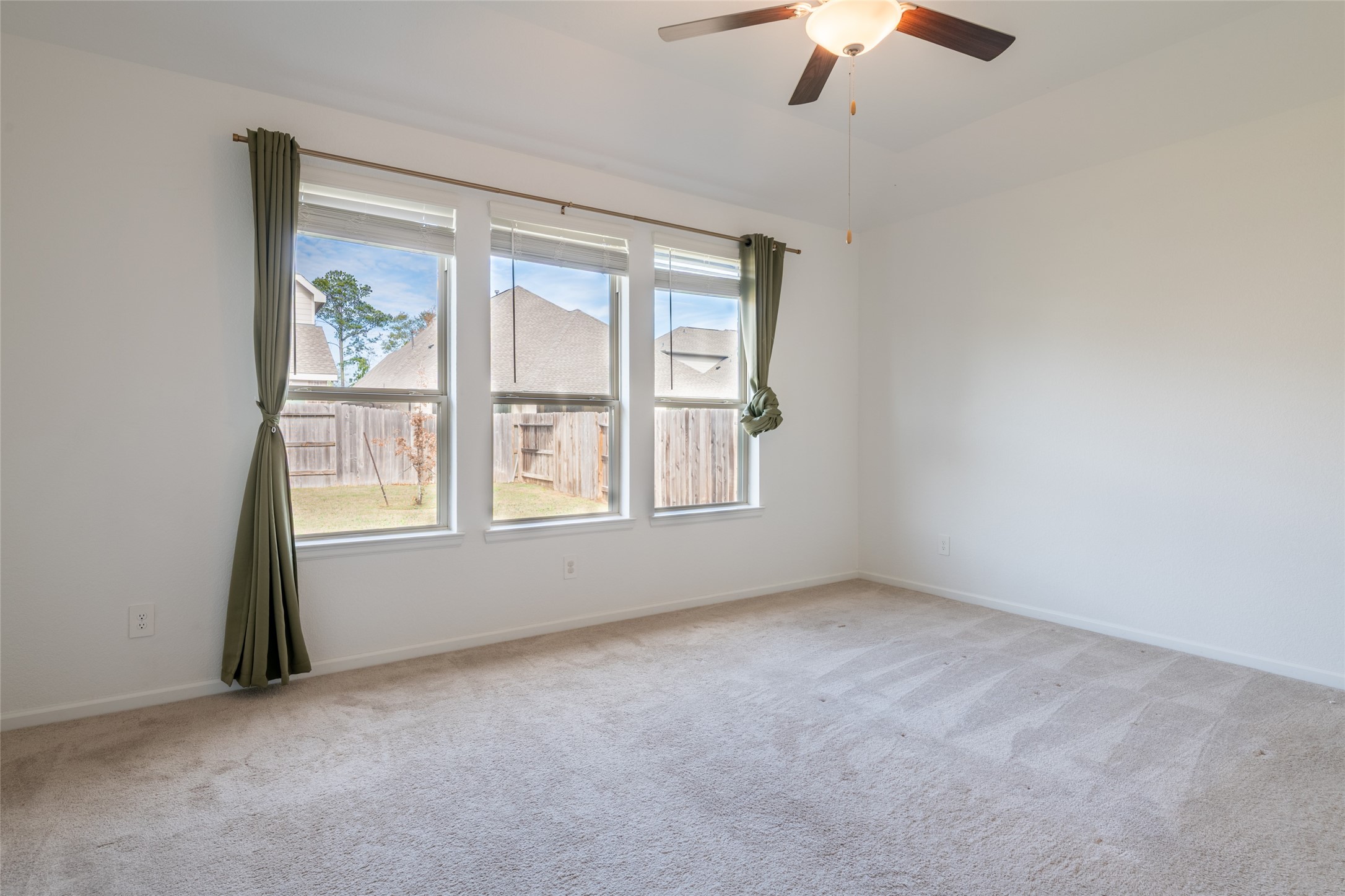 15023 Mulberry Hallow Street Conroe, TX 77302 - Photo 30 of 41 an empty room with a window