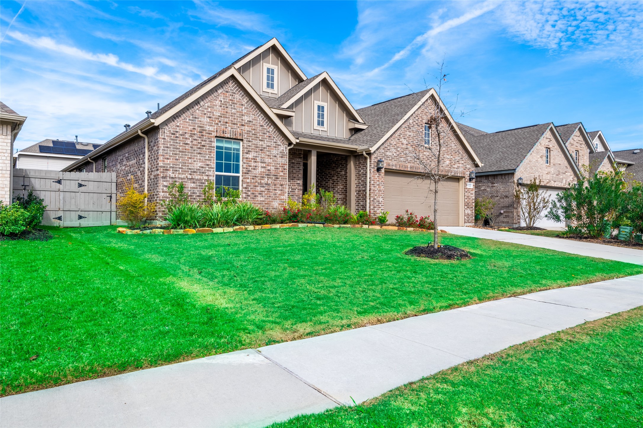 15023 Mulberry Hallow Street Conroe, TX 77302 - Photo 3 of 41 a front view of a house with garden