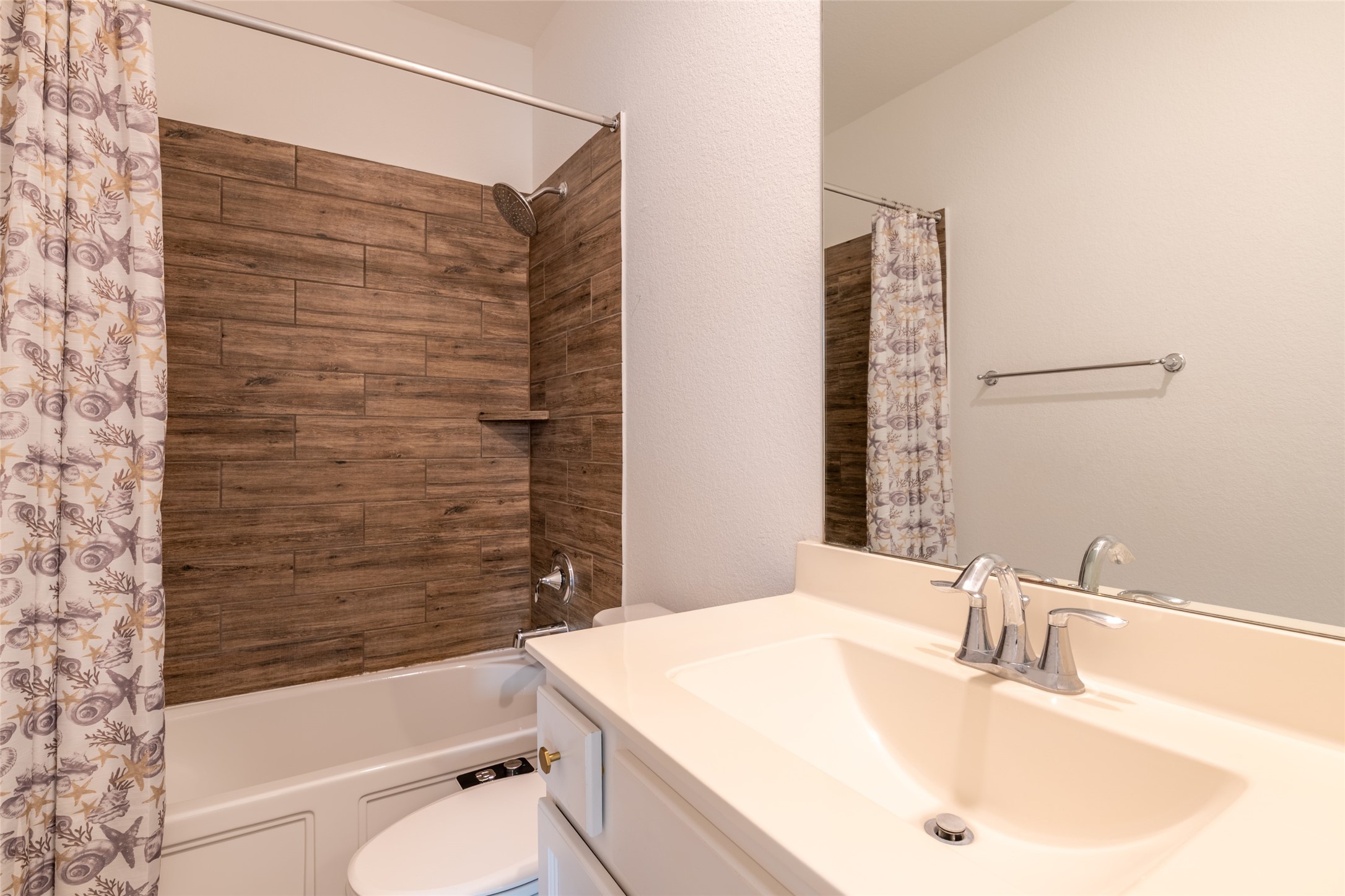 15023 Mulberry Hallow Street Conroe, TX 77302 - Photo 31 of 41 a bathroom with a sink a toilet and shower