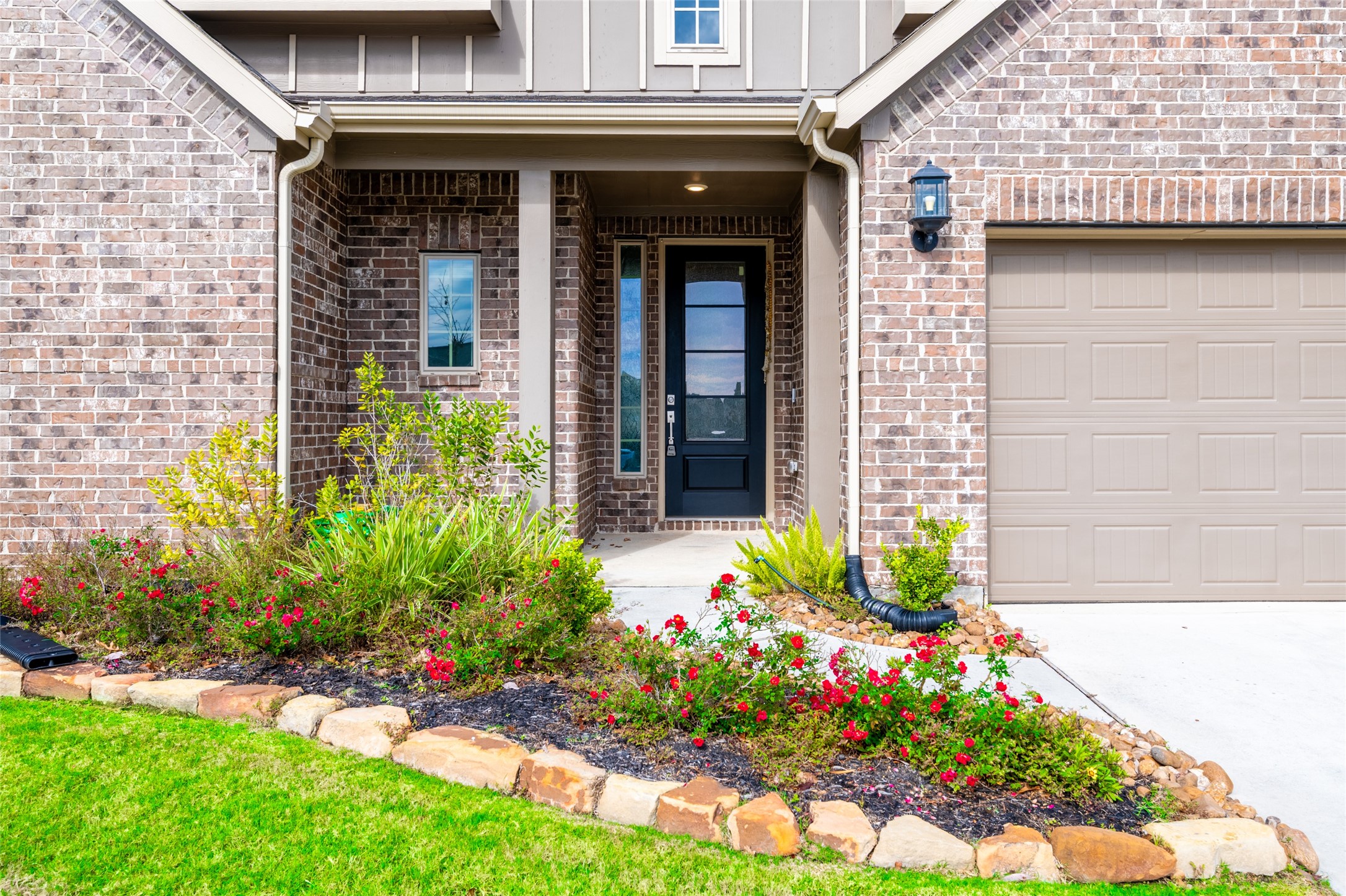 15023 Mulberry Hallow Street Conroe, TX 77302 - Photo 4 of 41 a front view of a house with a yard