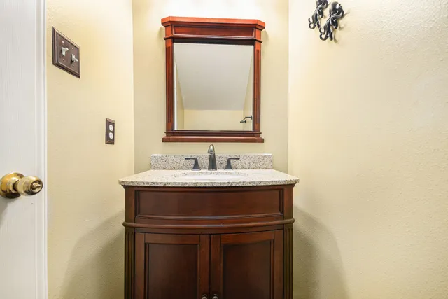 a bathroom with a sink and a mirror