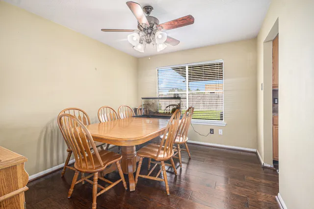a view of a dining room with furniture window and wooden floor