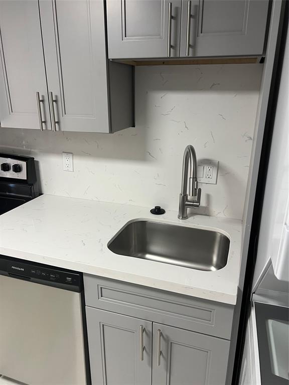 8705 Northwest 38th Drive, Unit 2A Coral Springs, FL 33065 - Photo 15 of 51 a kitchen with a sink and cabinets