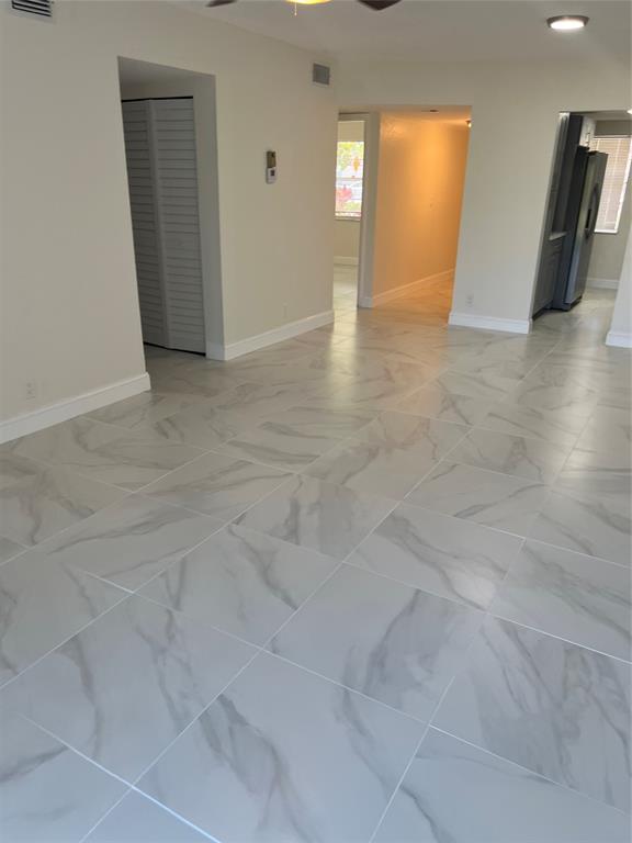 8705 Northwest 38th Drive, Unit 2A Coral Springs, FL 33065 - Photo 21 of 51 an empty room with windows and closet