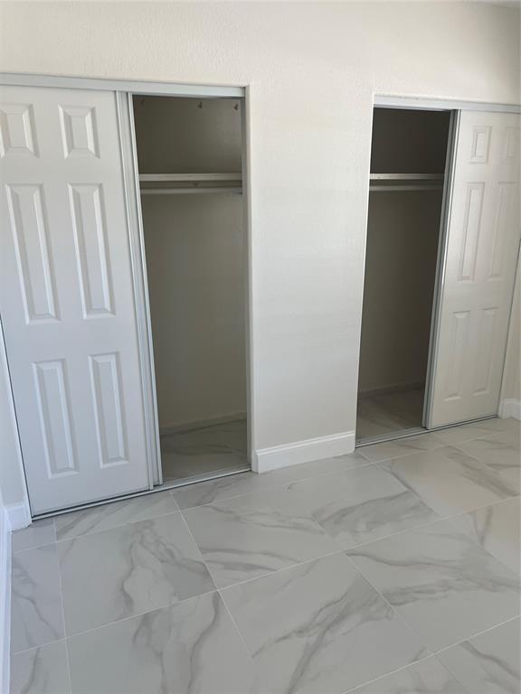 8705 Northwest 38th Drive, Unit 2A Coral Springs, FL 33065 - Photo 29 of 51 an empty room with closet area