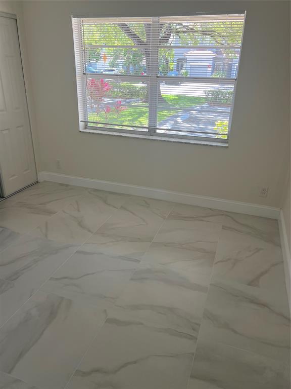 8705 Northwest 38th Drive, Unit 2A Coral Springs, FL 33065 - Photo 30 of 51 a view of empty room with window