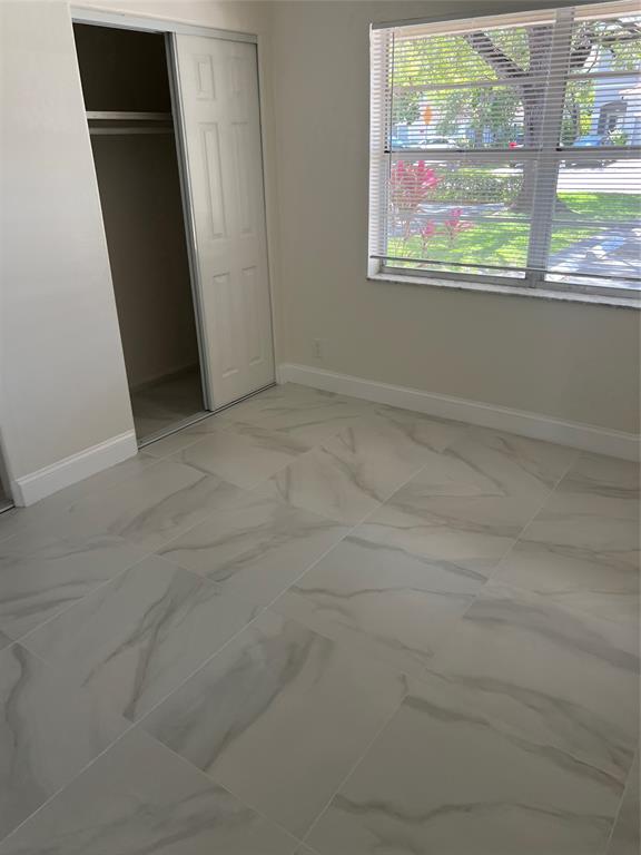 8705 Northwest 38th Drive, Unit 2A Coral Springs, FL 33065 - Photo 31 of 51 an empty room with window