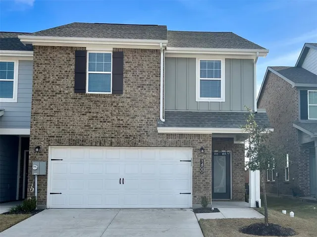 a front view of a house with a garage