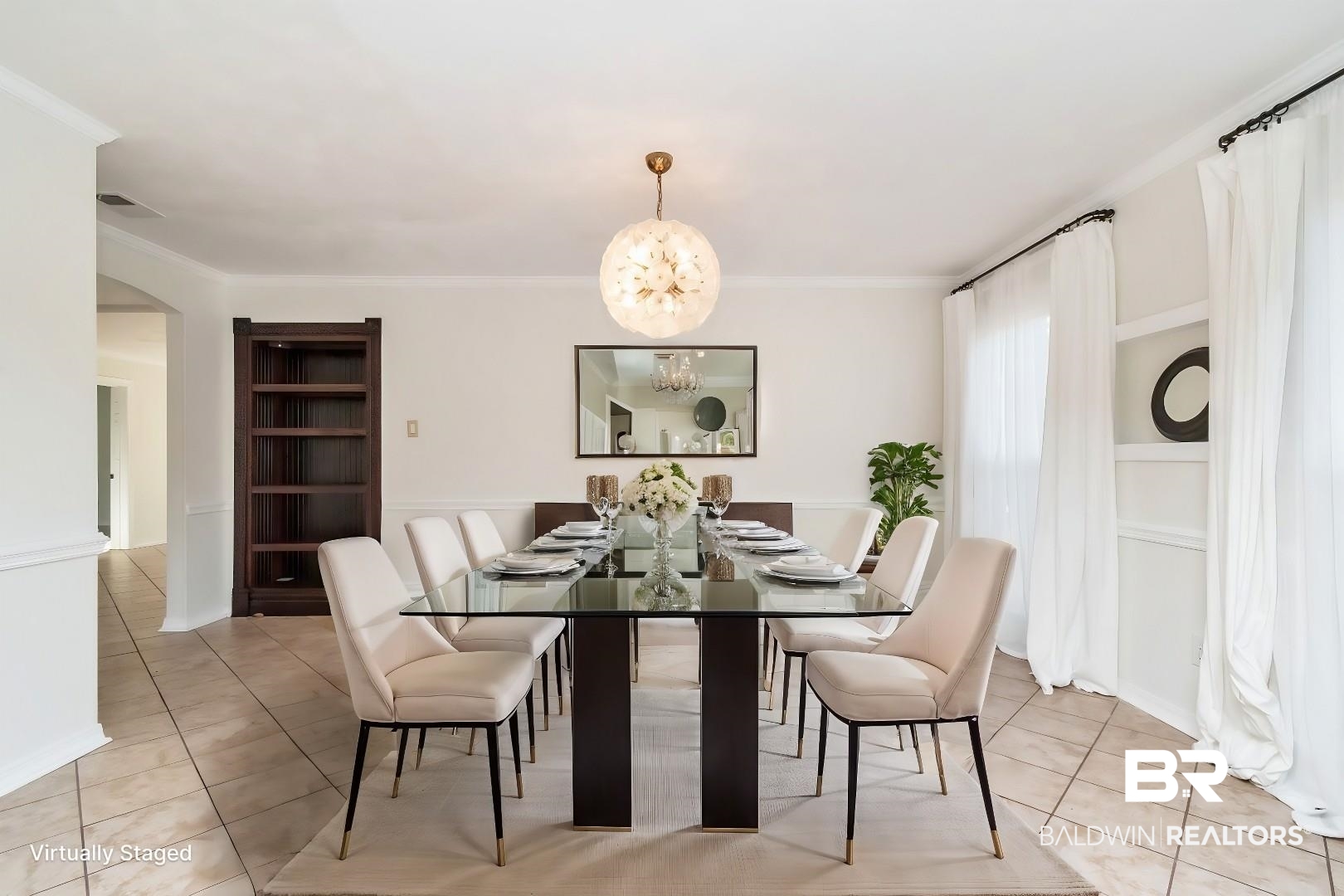 1508 Ridgeland Road East Mobile, AL 36695 - Photo 7 of 45 Dining room with built in features, arched walkways, a notable chandelier, light tile patterned floors, and ornamental molding