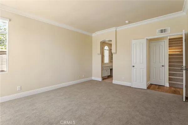 a view of a swimming pool with outdoor seating and plants