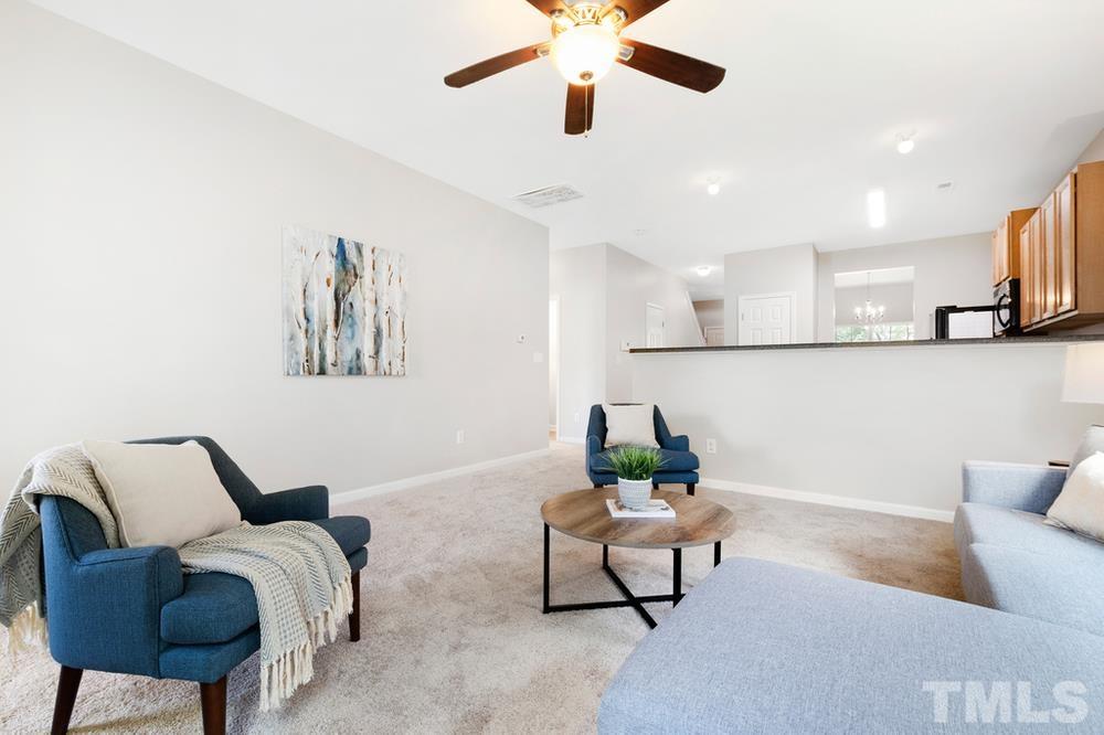 2520 Follow Me Way Raleigh, NC 27610 - Photo 11 of 30 a living room with furniture and a chandelier