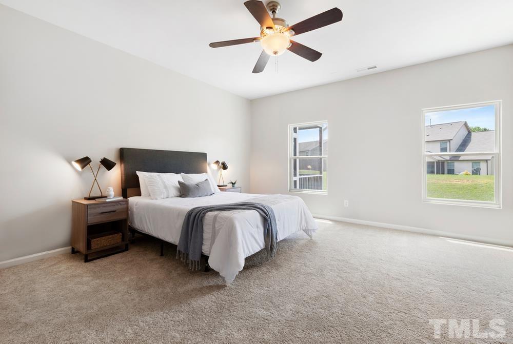 2520 Follow Me Way Raleigh, NC 27610 - Photo 12 of 30 a bedroom with bed and window