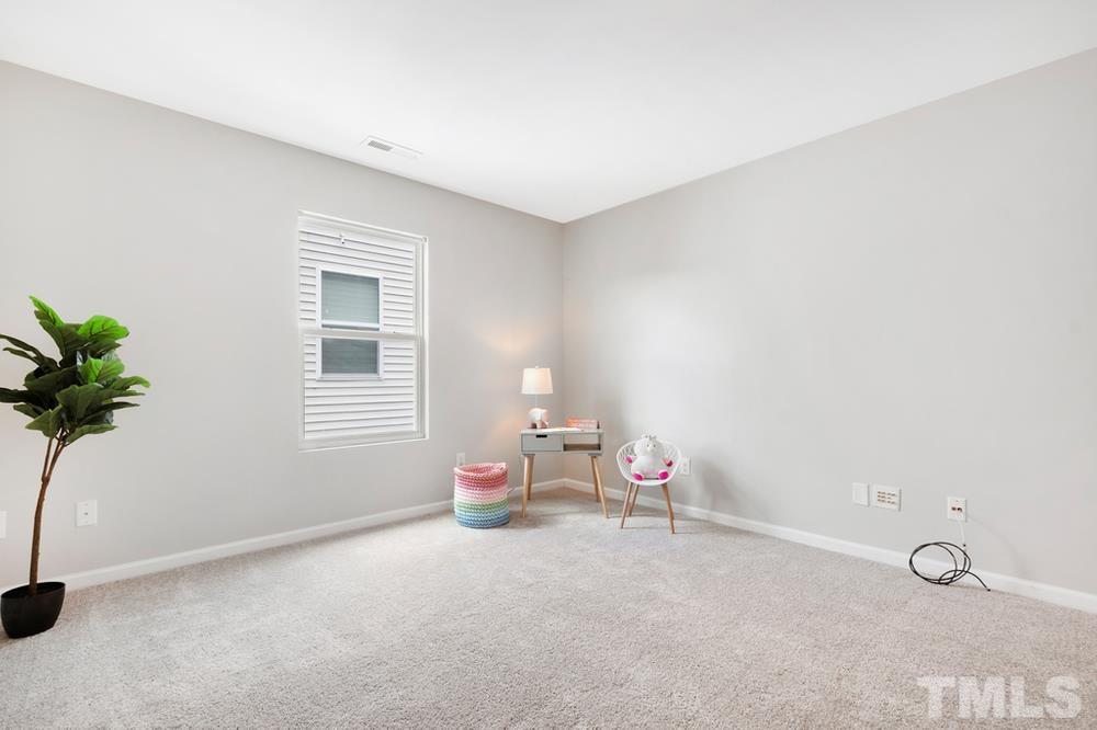 2520 Follow Me Way Raleigh, NC 27610 - Photo 16 of 30 a room with toys and a potted plant