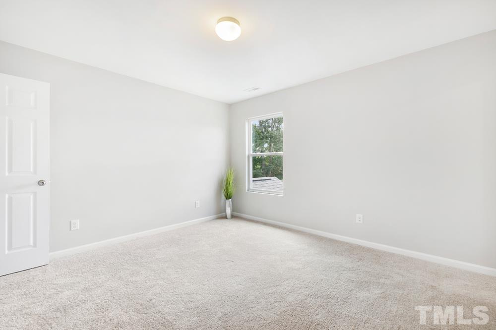 2520 Follow Me Way Raleigh, NC 27610 - Photo 21 of 30 an empty room with windows