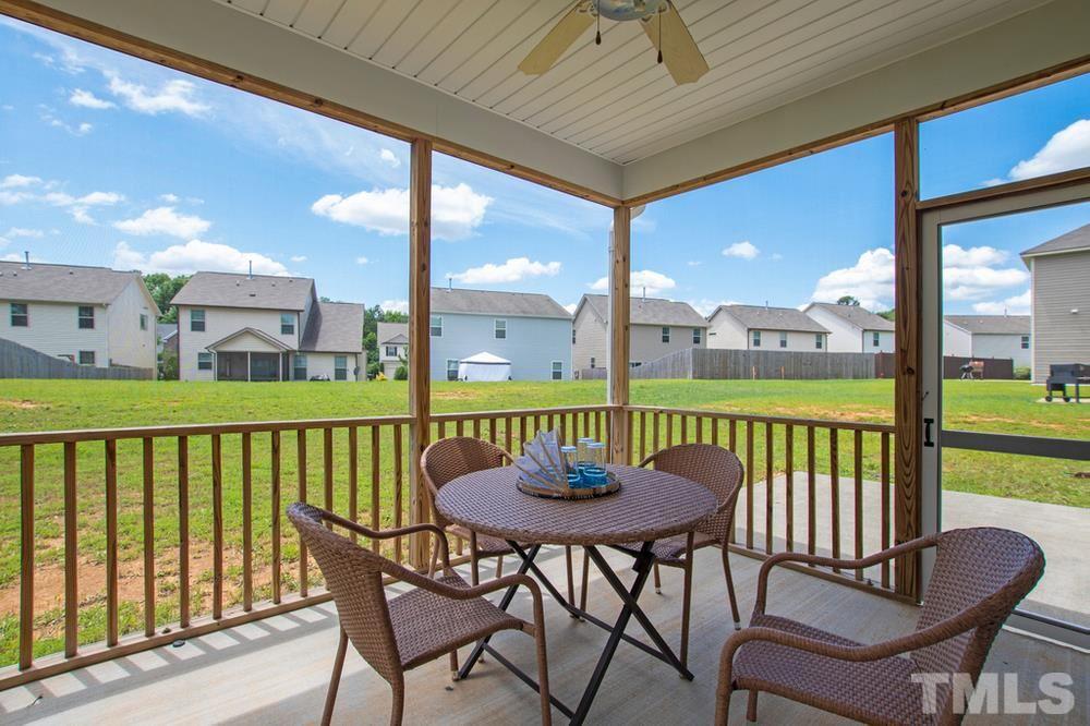 2520 Follow Me Way Raleigh, NC 27610 - Photo 26 of 30 a view of a balcony with table and chairs