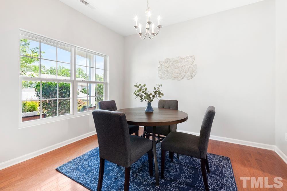 2520 Follow Me Way Raleigh, NC 27610 - Photo 5 of 30 a dining room with furniture a rug and a window
