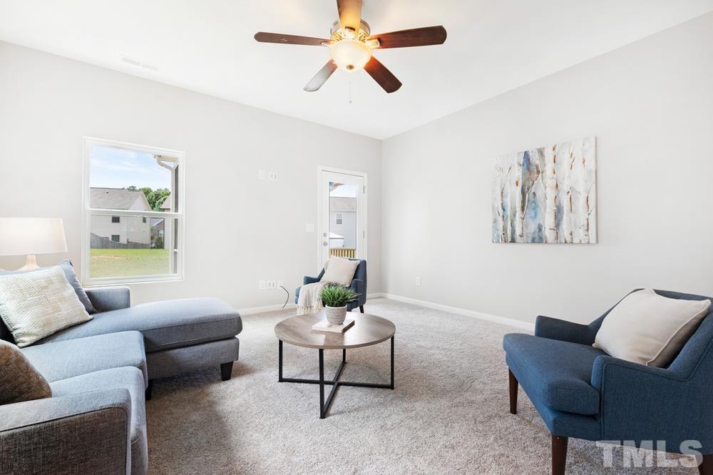 2520 Follow Me Way Raleigh, NC 27610 - Photo 10 of 30 a living room with furniture and a ceiling fan