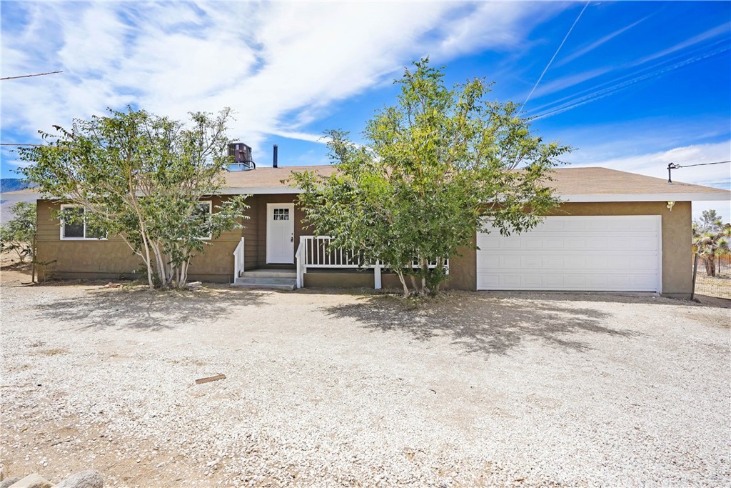 9324 Cody Road Lucerne Valley, CA 92356 - Photo 1 of 1 a view of a house with a yard and plant