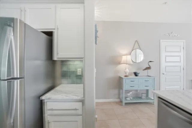 a bedroom with a bed and flat screen tv