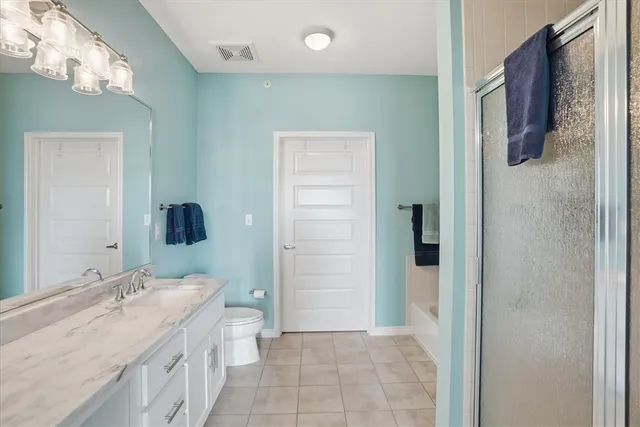 an aerial view of a city with lawn chairs