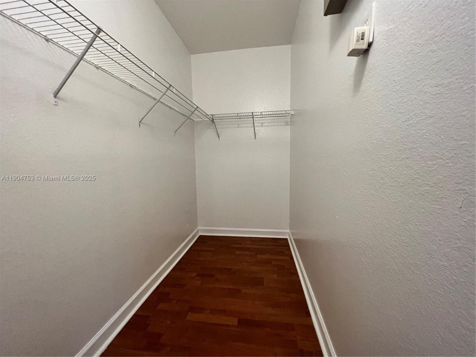 8564 Southwest 214th Way Cutler Bay, FL 33189 - Photo 11 of 31 a view of a room with racks on the wall