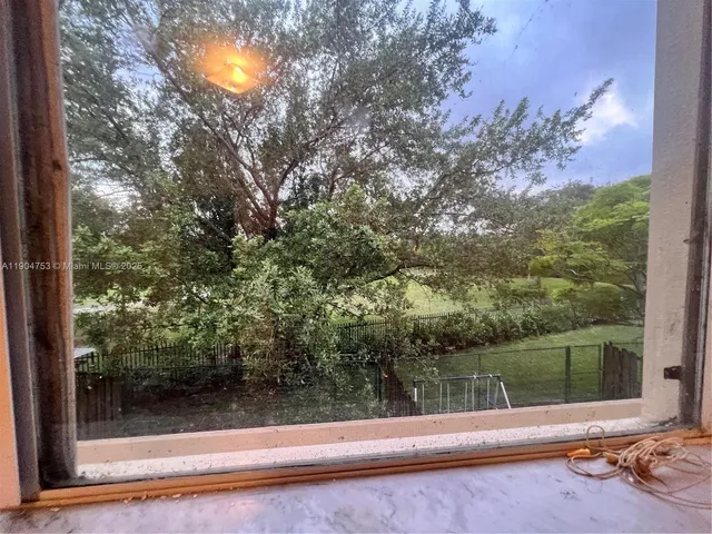 a view of a bench in a yard