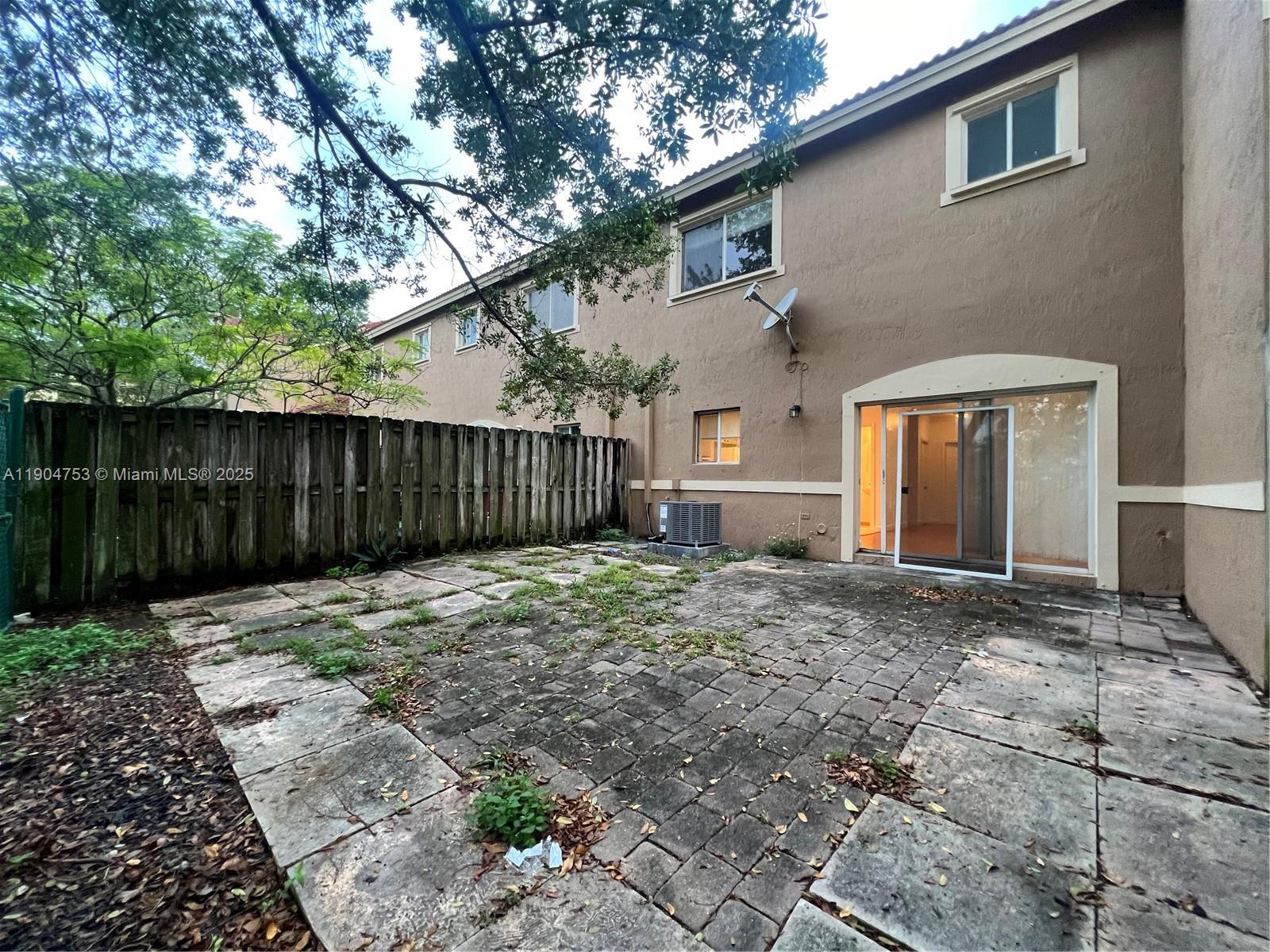 8564 Southwest 214th Way Cutler Bay, FL 33189 - Photo 18 of 31 a view of a house with a backyard